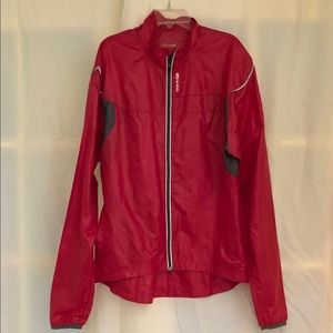 Lightweight Sugoi red windbreaker front zipper